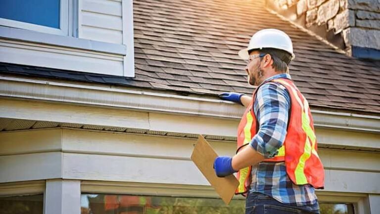 Roofing contractor in Moreno Valley CA inspecting a residential roof